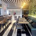 Dimbulah Coffee - Raffles Hospital | Product Seen: [Customised Laminated Tabletop With Natural Plywood Edging + Cosson Table base, Back to Back Booth Seat (Storage optional), Customised Furniture & Otaru Barchair]